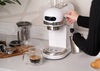Ardesto YCM-E1500 coffee machine with stainless steel finish and brewing handle, ready for brewing fresh coffee.