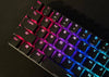 Wireless ASUS M601 ROG Falchion keyboard with Cherry RGB switches, compact design, and customizable backlit keys.